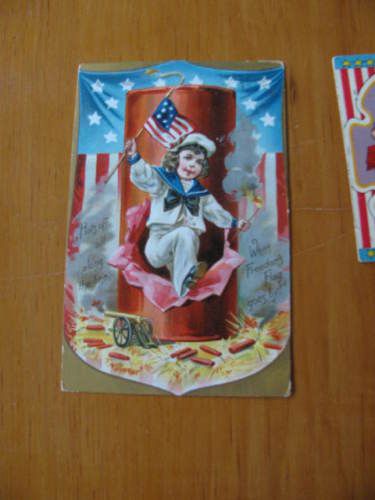 4th of July Boy emerging from large firecracker 1910era  